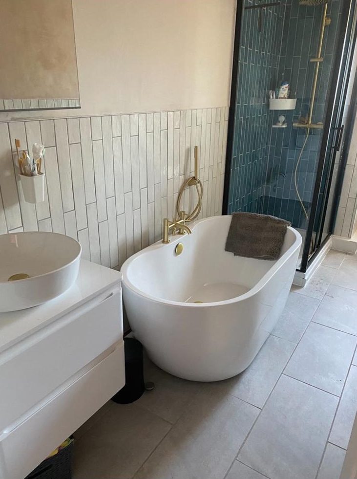 Bathroom with freestanding bath, brushed brass taps and walk-in shower