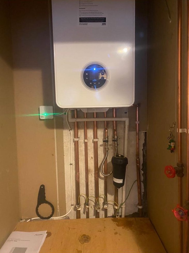 Worcester Bosch combi boiler fitted in a cupboard with magnetic filter