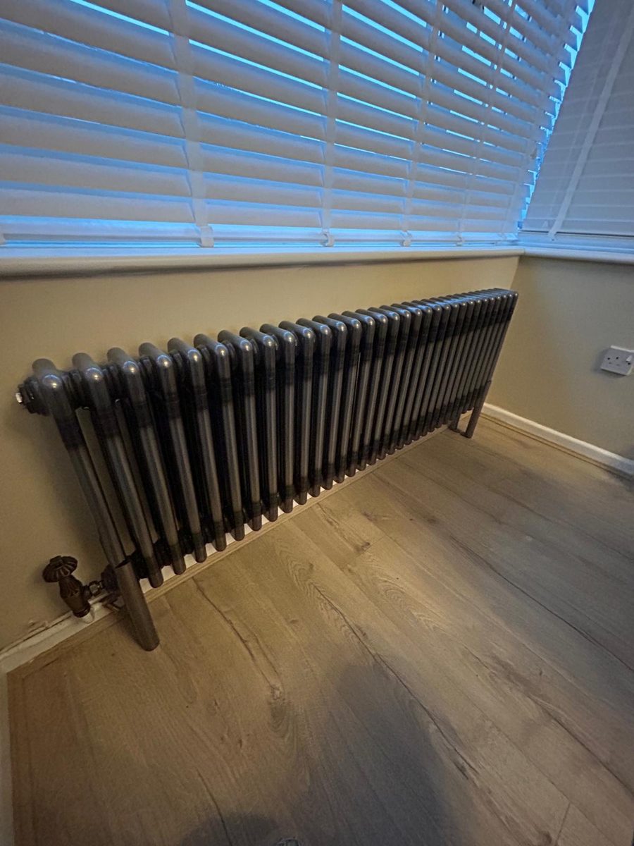 Traditional cast-iron style column radiator with period valve